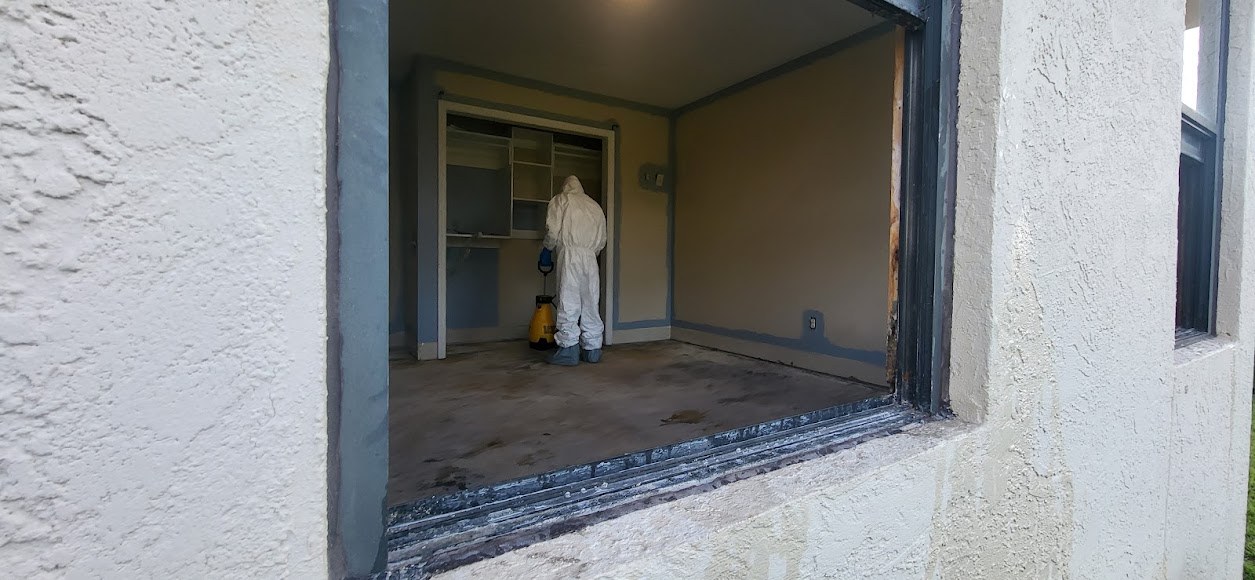 Interior work viewed through an exterior opening