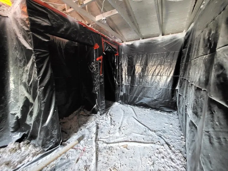 Work area enclosed with protective sheeting